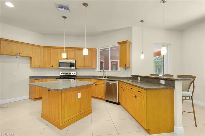 The kitchen has built in niches and a walk in pantry.
