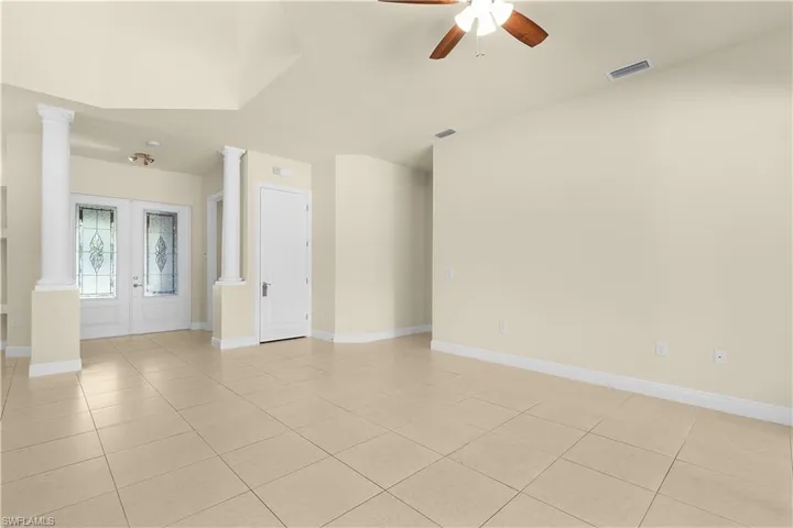 View from the Dining Room into the Living Room. The door to the left is the entrance to the Primary Suite.