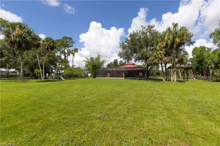 Large pool, with spa and area to lounge and enjoy the tranquility of the wooded backyard. Enjoy the best that Florida has to offer year round.