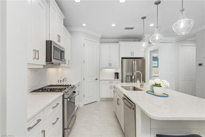 White Cabinetry, Stainless, Quartz.