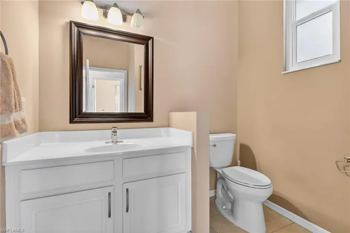 Bathroom with vanity and light tile patterned floors