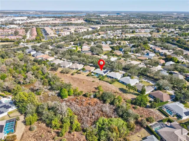 View of property location with nearby suburban area