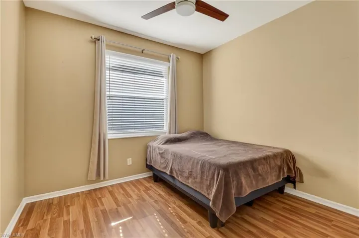 Bedroom featuring light wood-type flooring and ceiling fan