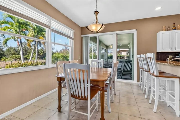 Dining room with light tile patterned floors