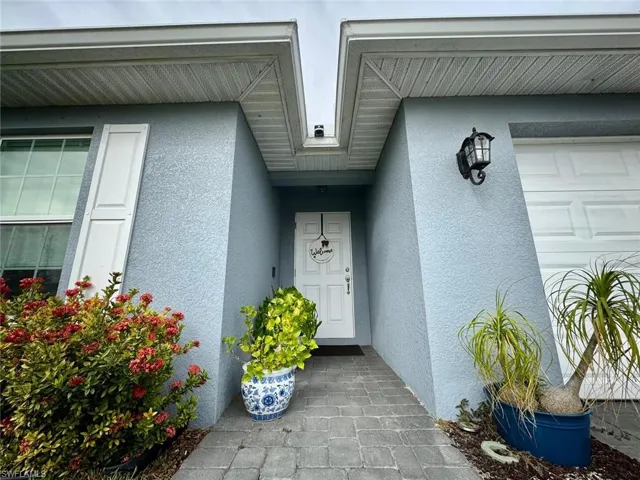 Entrance to property featuring a garage