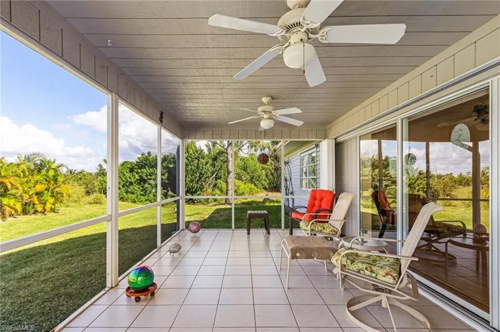 Pocket sliding glass doors with accordion hurricane shutters.