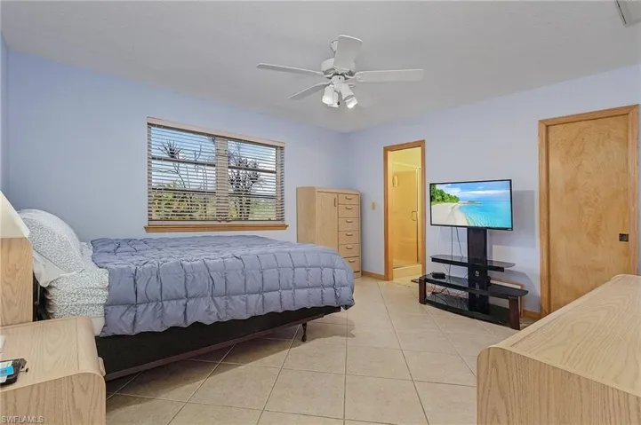 Master bedroom with en suite bathroom and walk-in closet