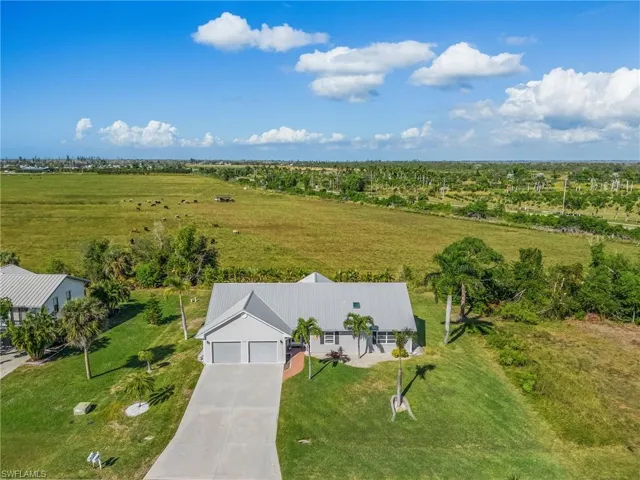 Aerial view facing the open field to the north.