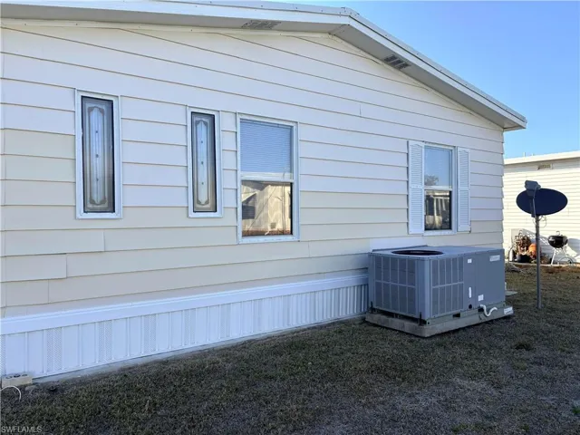 View of property exterior featuring a central AC unit
