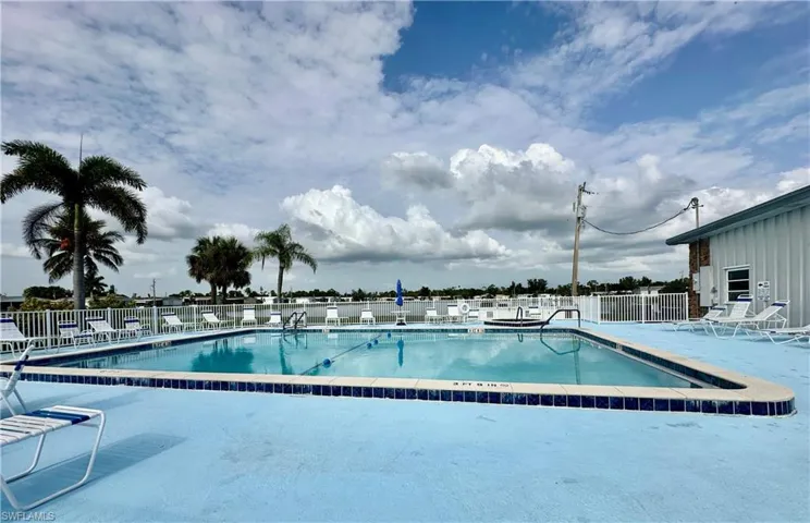 Community pool featuring a patio