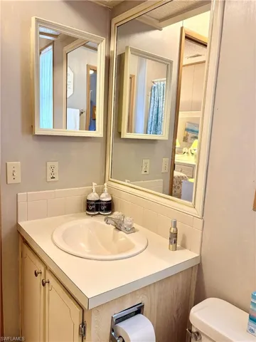 Bathroom with vanity and toilet