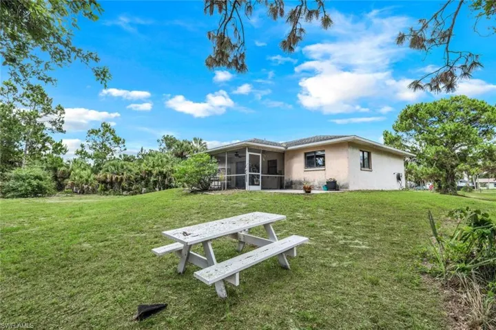 View of yard featuring a sunroom