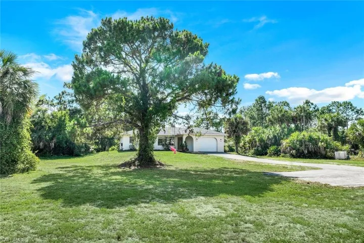 View of yard with a garage