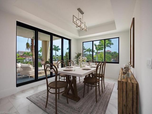 Dining Room is part of the Great Room/Living Room is light and bright with access to Lanai.