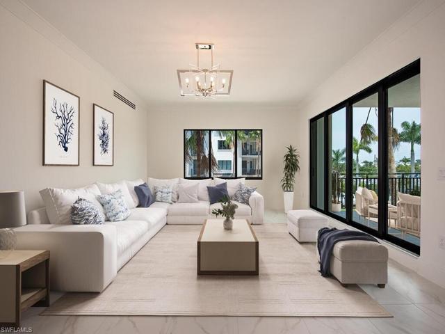 Great Room/Living Room/Kitchen/Dining Room feature beautiful tile floors throughout the condo. Luxury finishes and high-end appliances, quartz countertops, custom cabinetry. Open, airy, and bright, you feel right at home for a Naples Paradise get-away or to entertain with ease.