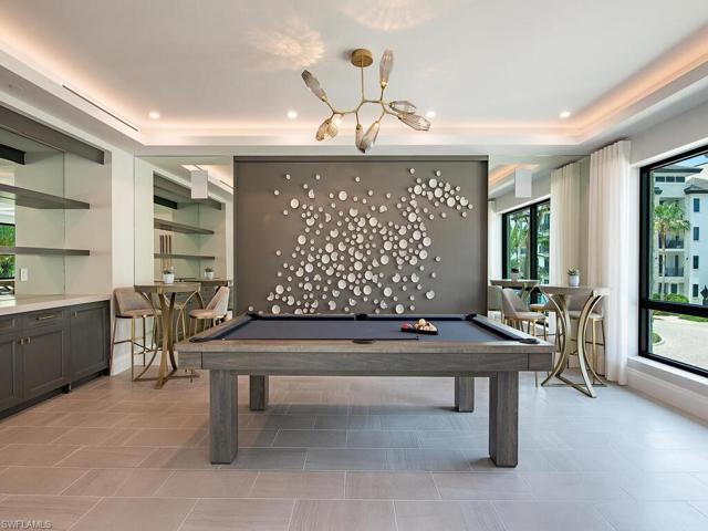 Quattro at Naples Square Community area offers a billards table, game area, large-screen TV's, and chefs kitchen for entertaining.