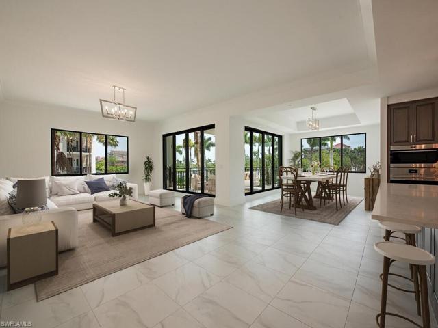 Great Room/Living Room/Kitchen/Dining Room feature beautiful tile floors throughout the condo. Luxury finishes and high-end appliances, quartz countertops, custom cabinetry. Open, airy, and bright, you feel right at home for a Naples Paradise get-away or to entertain with ease.