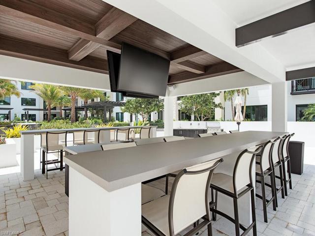 Quattro at Naples Square outdoor dining, natural gas grills, firepit, pool and spa, and courtyard for resident's only to enjoy year round.