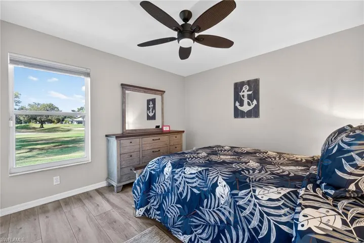 Bedroom featuring wood finished floors and a ceiling fan