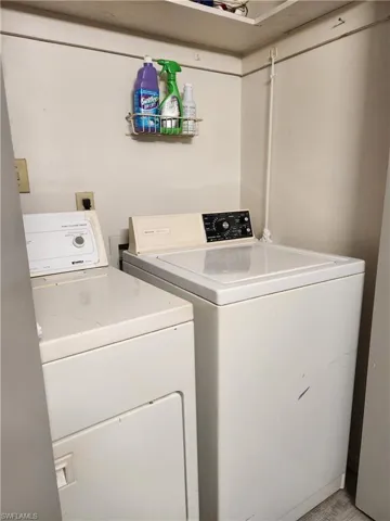 Laundry area featuring washing machine and clothes dryer