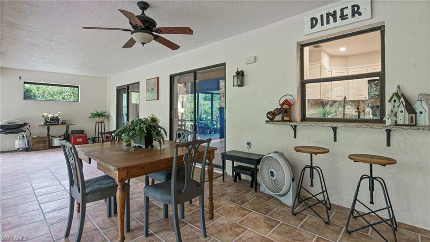 Kitchen window opens to lanai and becomes a bar area
