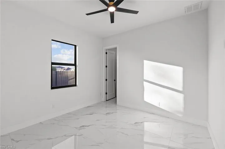 Unfurnished room with ceiling fan