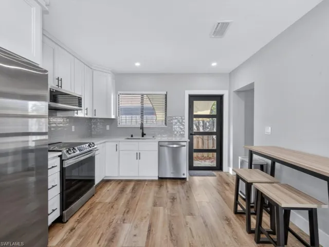 Eat-in kitchen and door to the backyard.