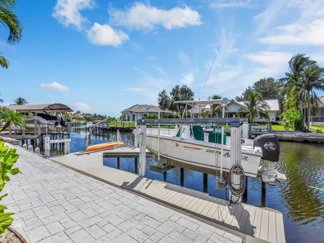 Dock and sunbath area with a water view