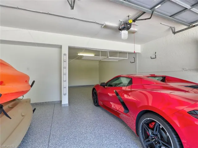 View of  Deep 3 car Tandem garage/ With added overhead storage
