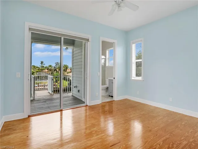 Empty room with ceiling fan and light wood-type flooring