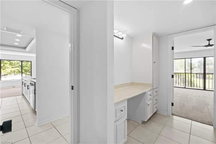 Bathroom featuring recessed lighting, light tile patterned floors, ceiling fan, vanity, and light carpet