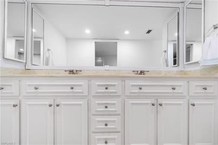 Bathroom featuring double vanity and recessed lighting