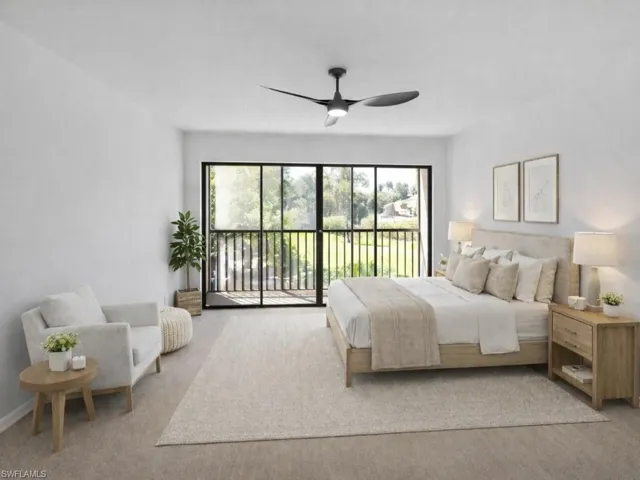 Bedroom featuring access to exterior, light carpet, and ceiling fan