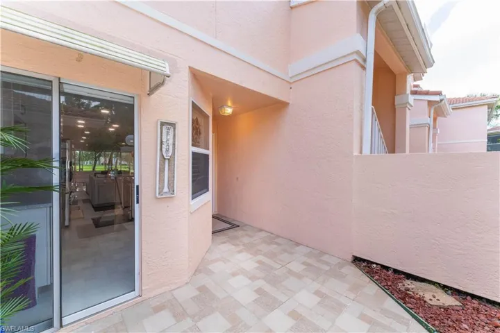 Entrance to property featuring stucco siding