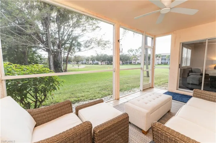 Sunroom / solarium featuring ceiling fan and a patio area