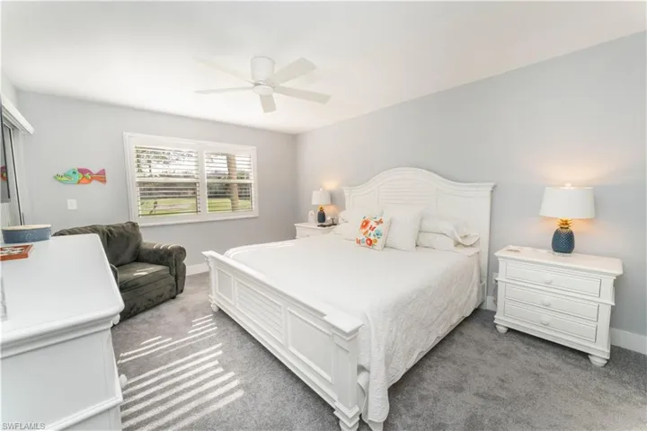 Bedroom with carpet and ceiling fan