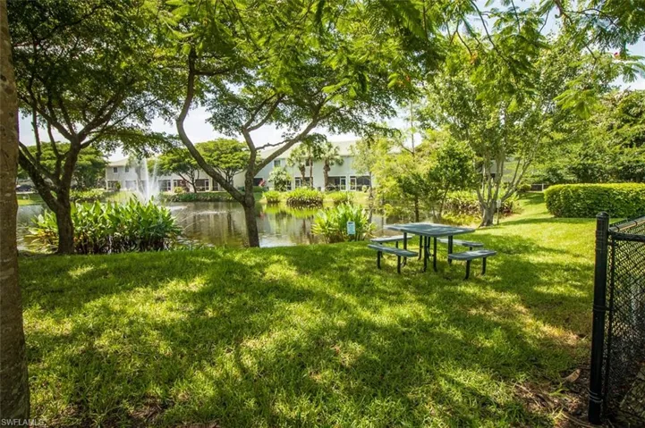 View of green lawn with a water view