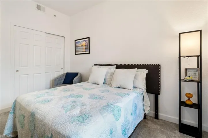 Bedroom with carpet and a closet