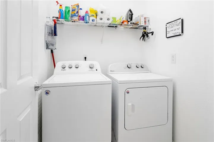 Washroom with washing machine and dryer