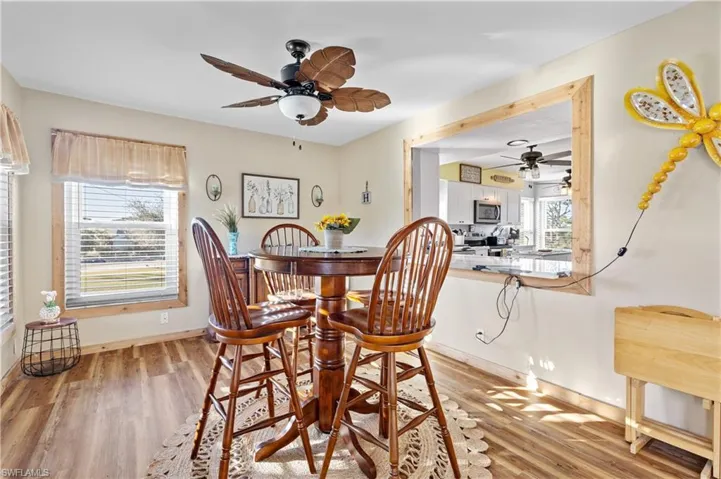 Dining space featuring ceiling fan and light