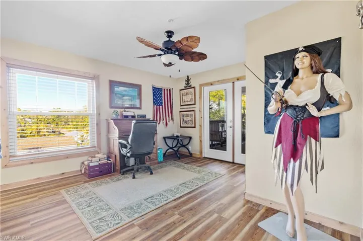 Home office with french doors to screened in porch