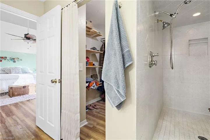 Primary bedroom walk in closet