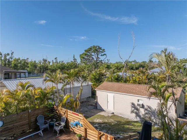 Wooden deck, privacy fence and shed
