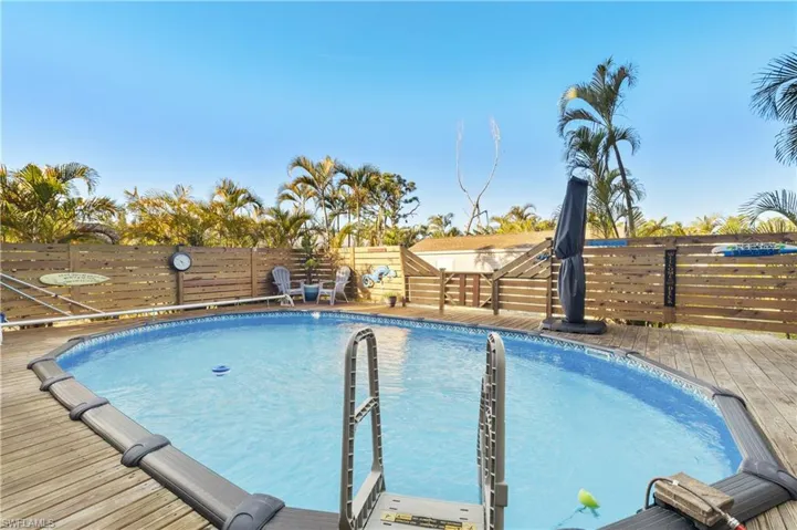 View of pool featuring a deck