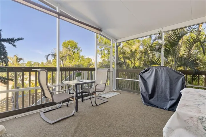 Screened in porch overlooking pool area