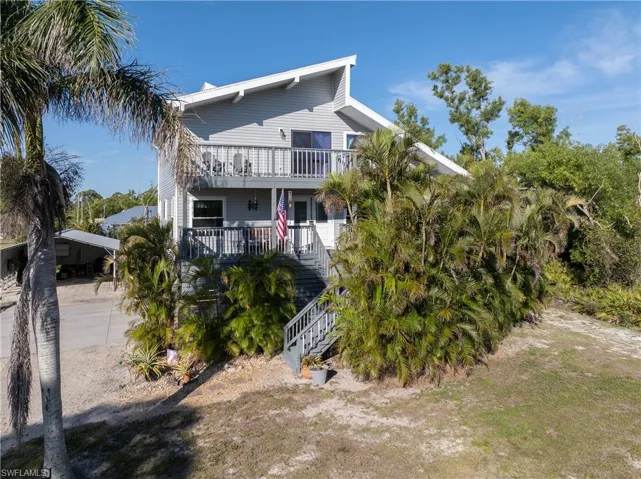 View of front of home with a carport