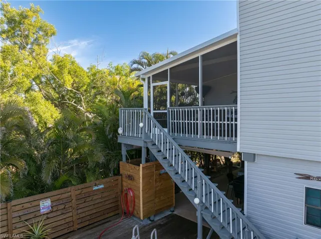 Screened in view of porch that overlooks the pool