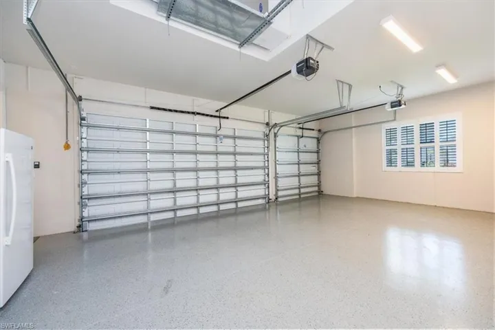 3-Car Garage with refrigerator - included