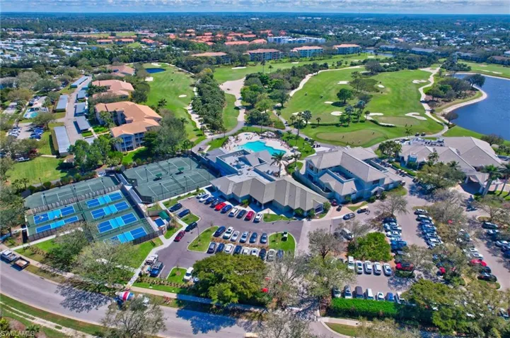 Aerial overview of property's location featuring a local golf course and a large body of water