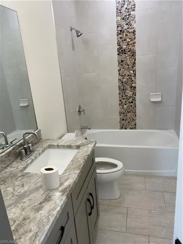Full bath with vanity and bathing tub / shower combination